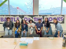 students that participated in Battle of the Books posing in front of a window